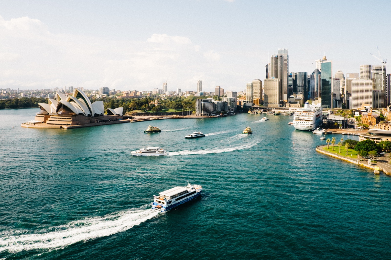 boats in a body of water with boats in it