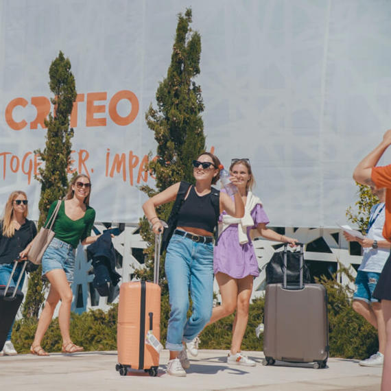 a group of women carrying luggage