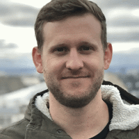 a man smiling for a picture
