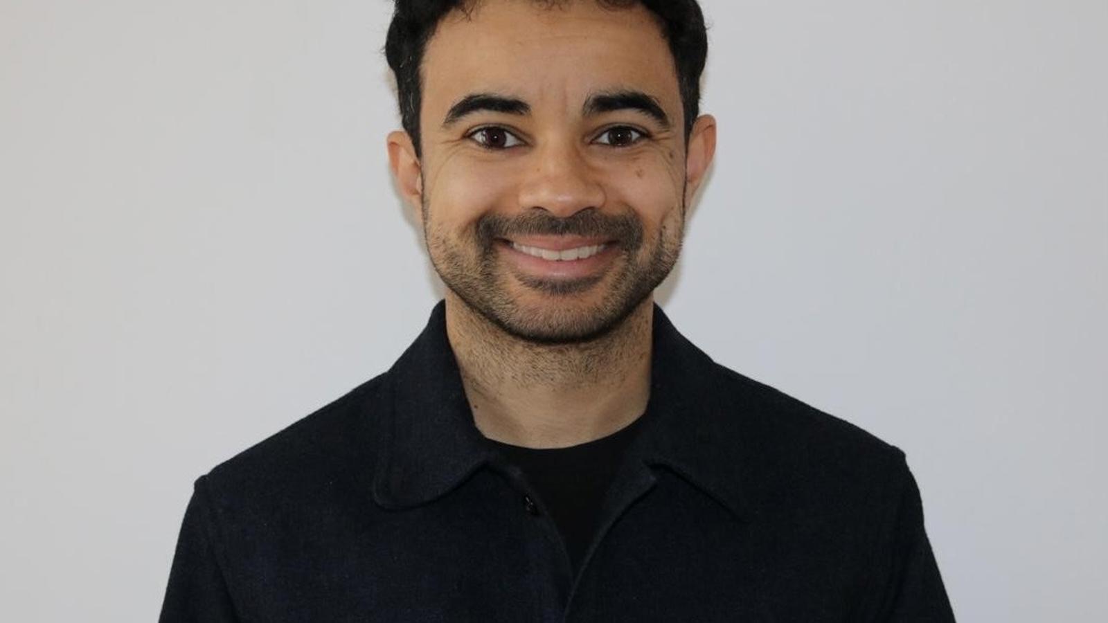 a man smiling for a picture