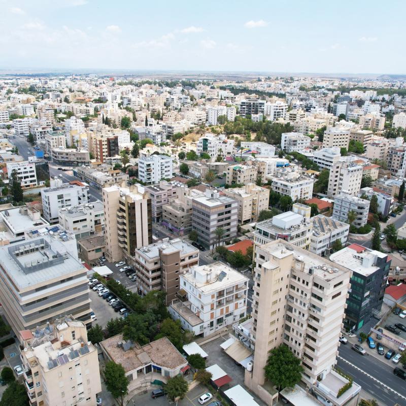 a city with many buildings and trees