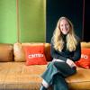 a woman sitting on a couch
