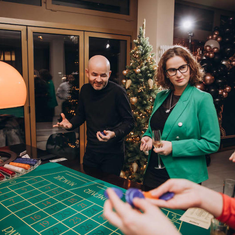 a group of people standing around a table