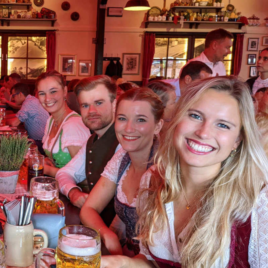 a group of people sitting at a table with drinks