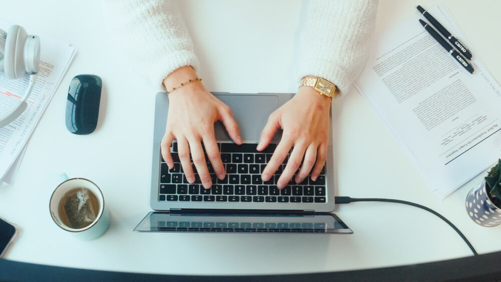 a person typing on a laptop