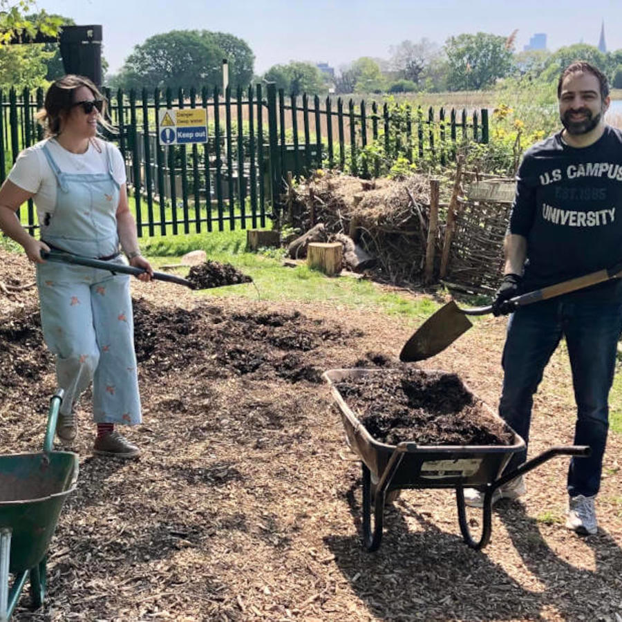 a man and woman working in a garden