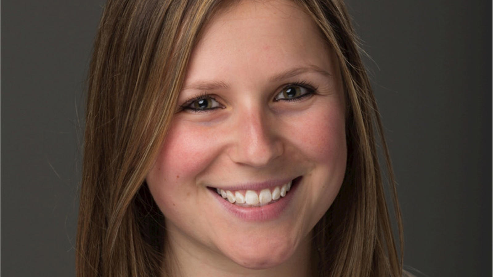 a woman smiling at the camera