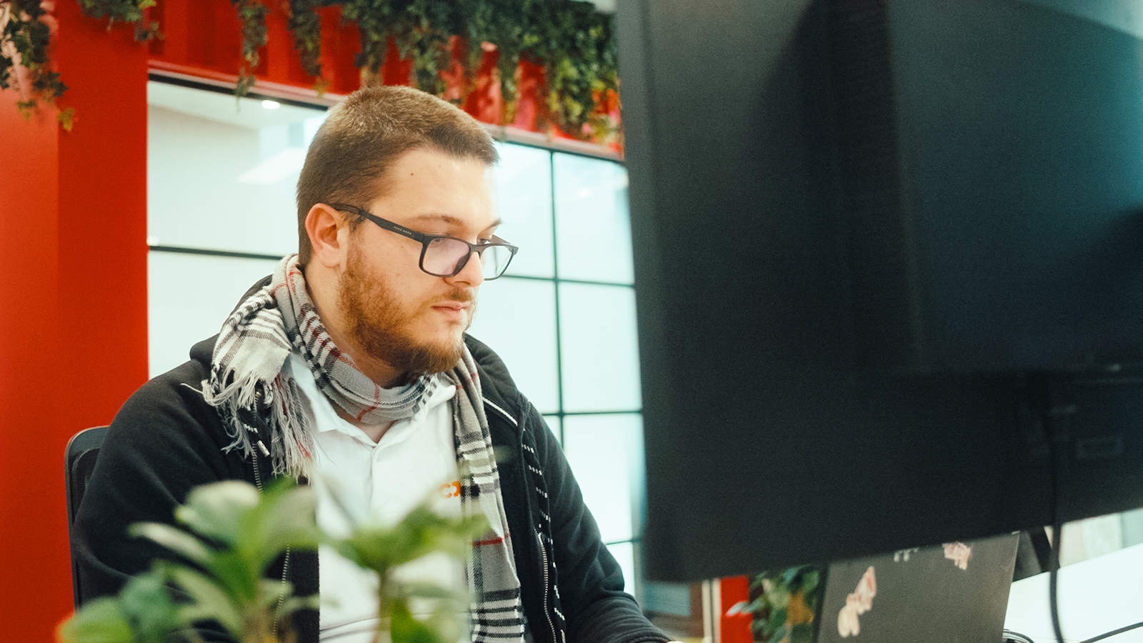 a man looking at a computer screen