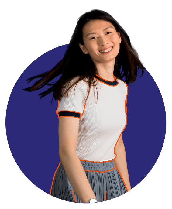 a woman smiling with her hair blowing in the wind
