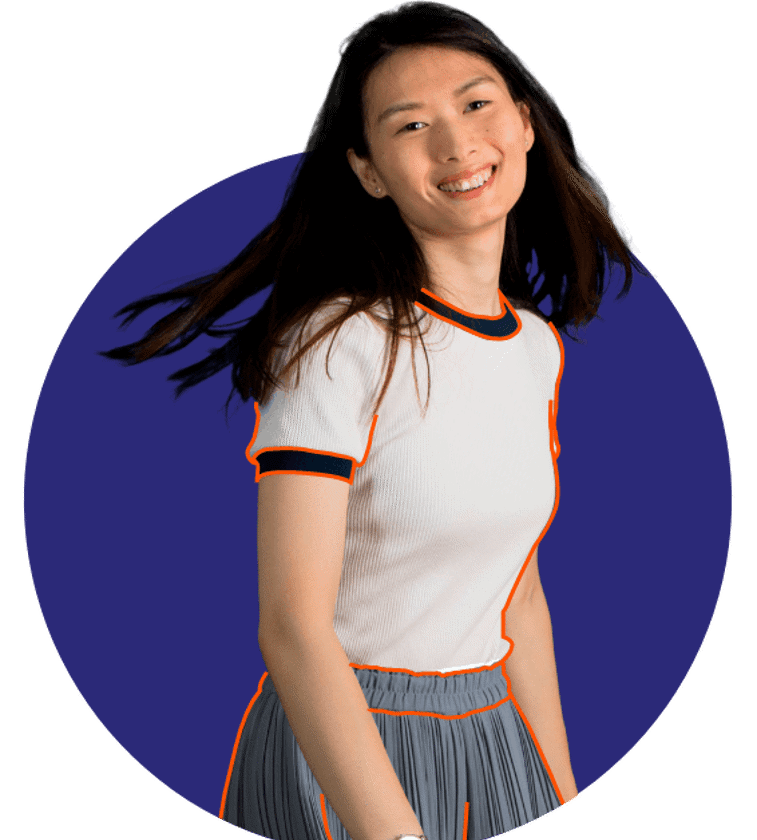 a woman smiling with her hair blowing in the wind